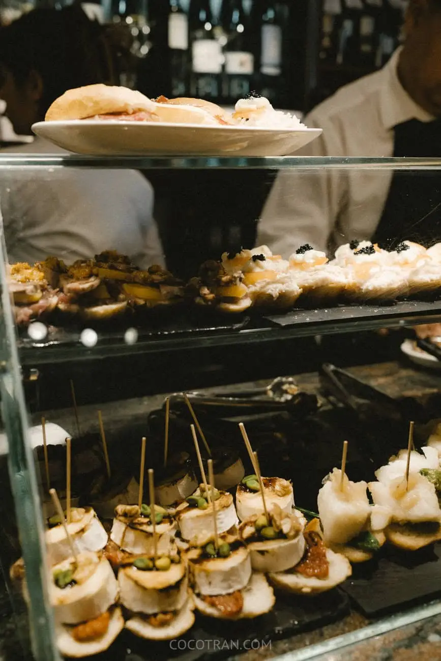 A bar counter laid with pintxos in the old town of San Sebastián