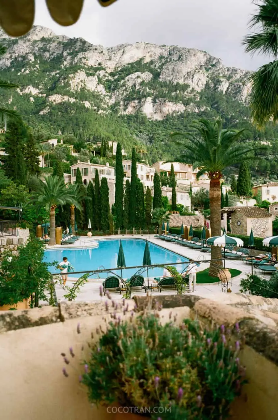 (2026) The Verdict: La Residencia, A Belmond Hotel, Mallorca The pool at La Residencia with cypresses and the village of Deiร beyond